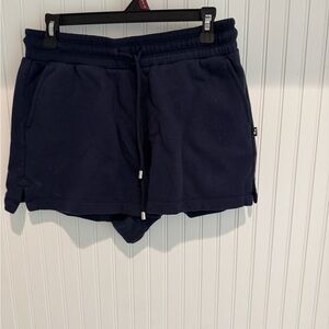 Navy sweat shorts.